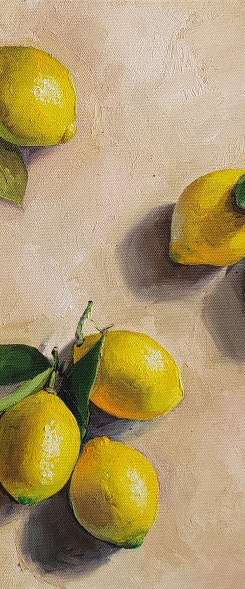 Lemon on cream background still life by Leyla Demir