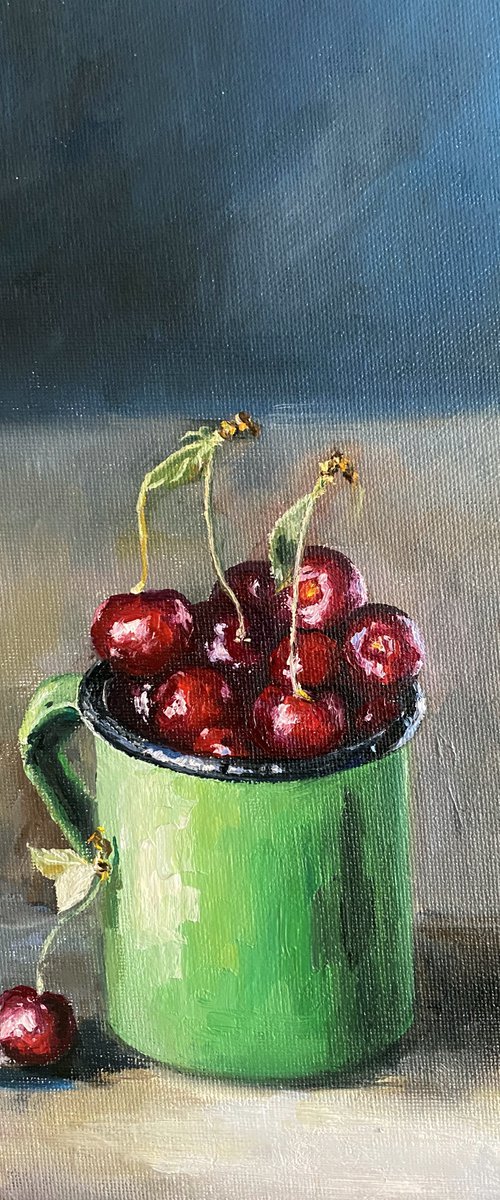 Cherry in a green cup by Elvira Sultanova