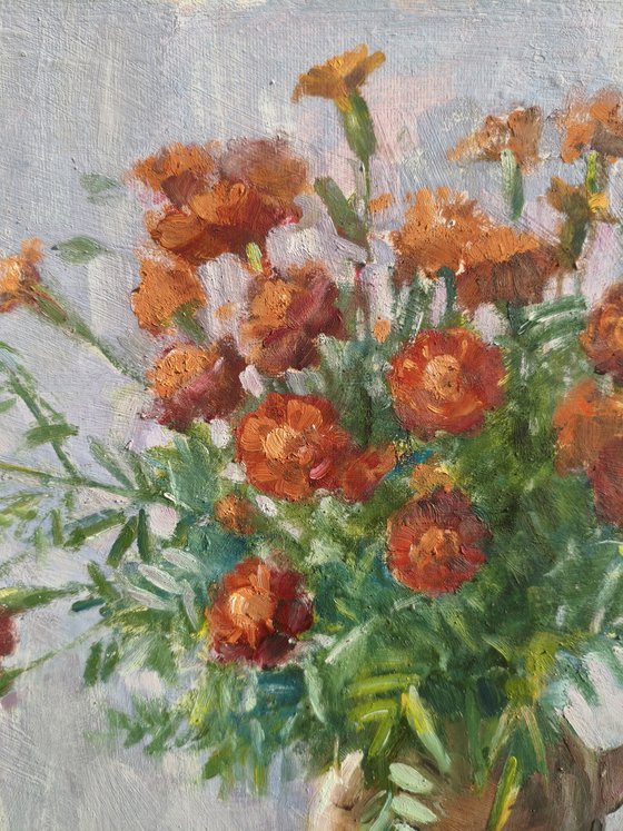 Marigolds in a clay pot