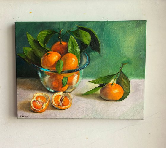 Tangerines in glass bowl