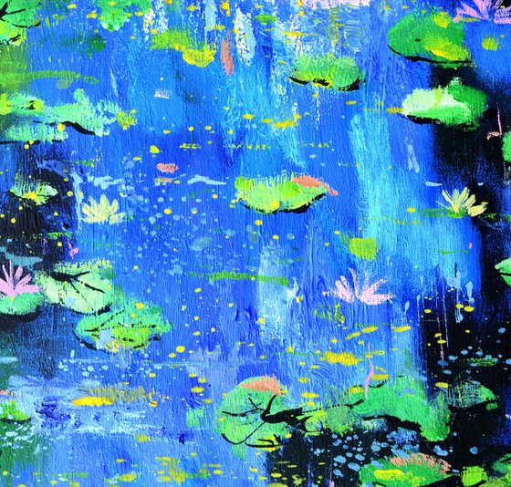 Waterlilies on a blue pond