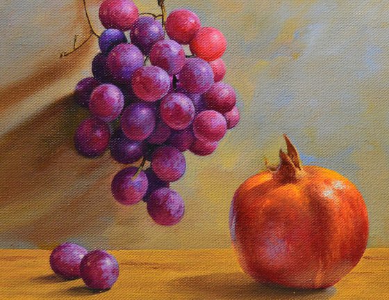 Still life with pomegranate and grapes