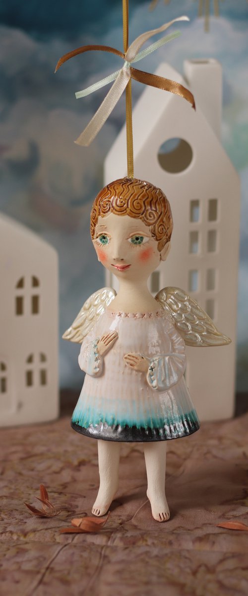 Tiny hanging sculpture by Elya Yalonetski. Smiling Angel by Elya Yalonetski