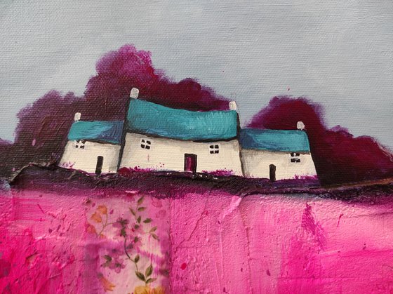 Little house on magenta pink patchwork field