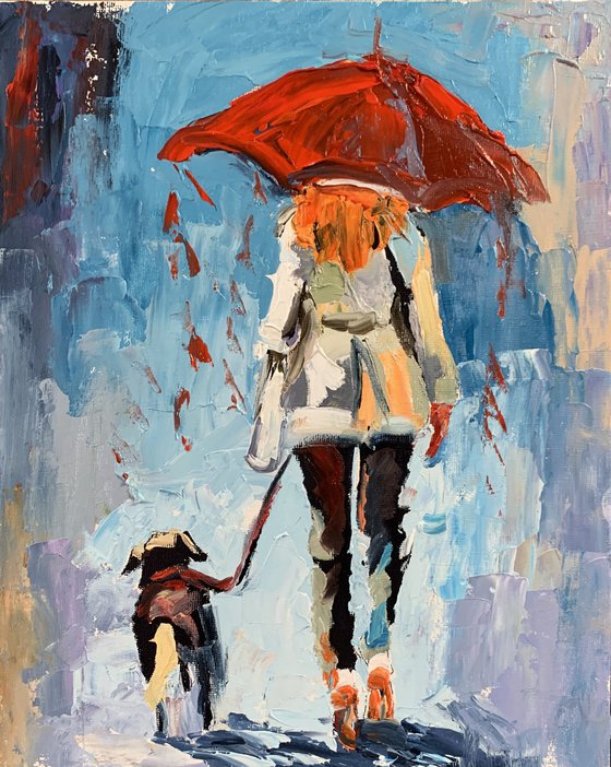 Woman with umbrella and dog.