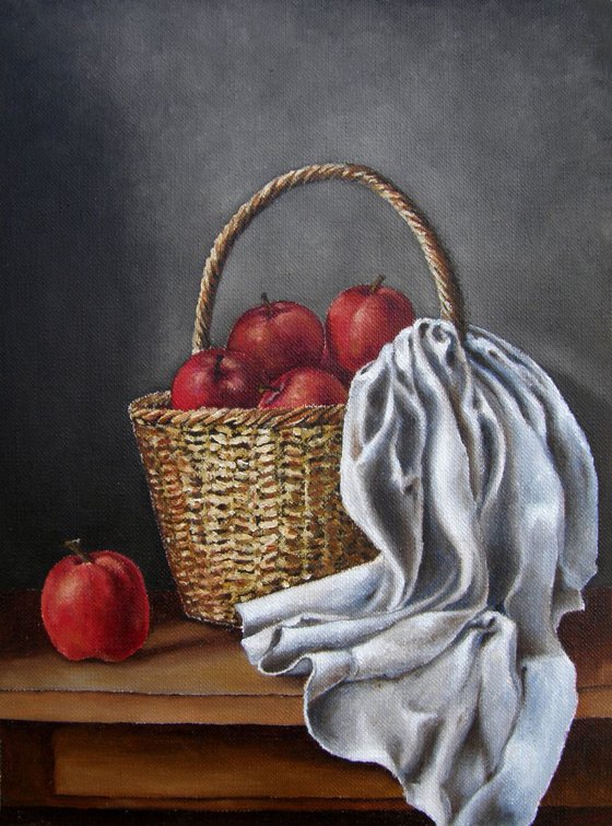 A basket and red apples