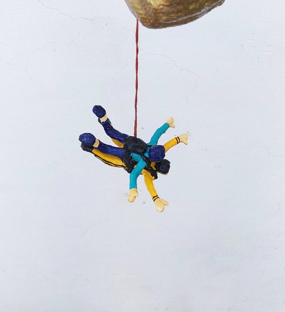Hand holding Tandem Skydivers