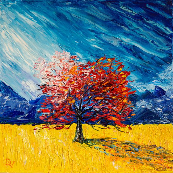 Red tree in a yellow field