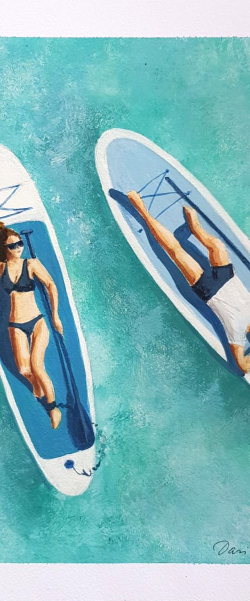 Couple on Sup boards by Daria Startseva