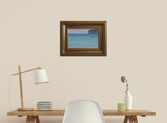 Sunset. Boats on the sea