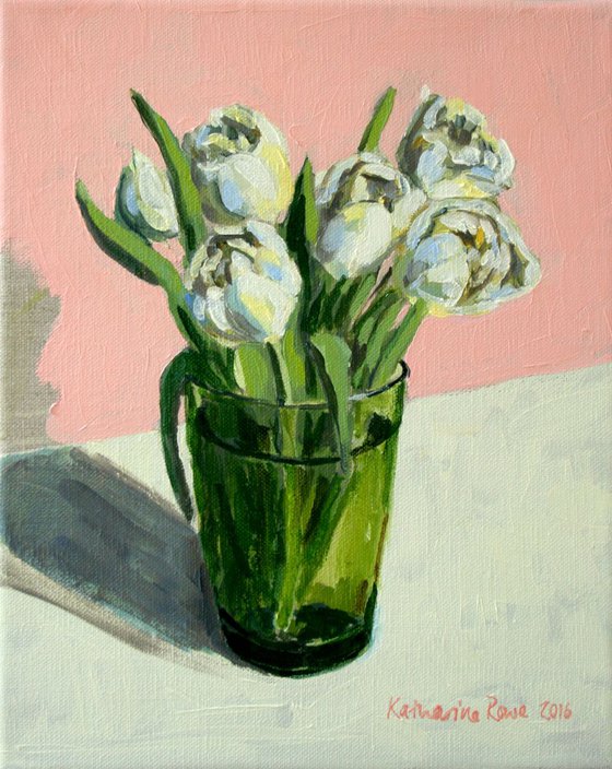 Tulips in a green glass