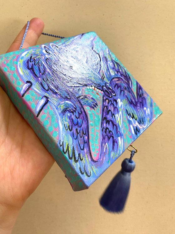 Blue funny dragon with a silk brush