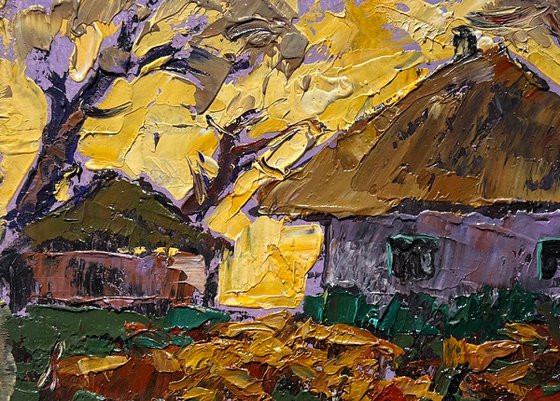 Yellow sunset behind houses