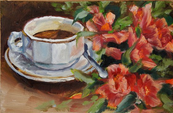 Tea cup with red flowers. Still life.