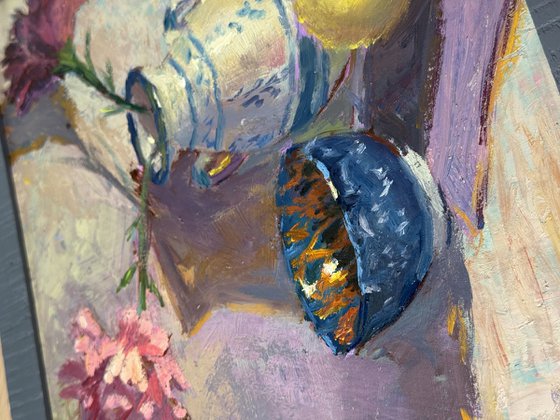 Lemons and flowers with a vase