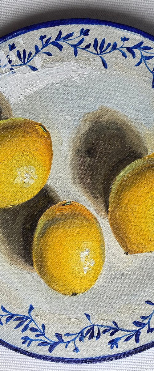 Lemons on plate by Leyla Demir