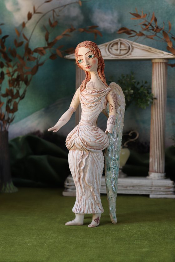 Angel with a tattoo. Ceramic OOAK sculpture.