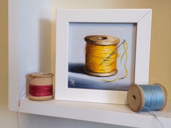 Little yellow cotton reel still life