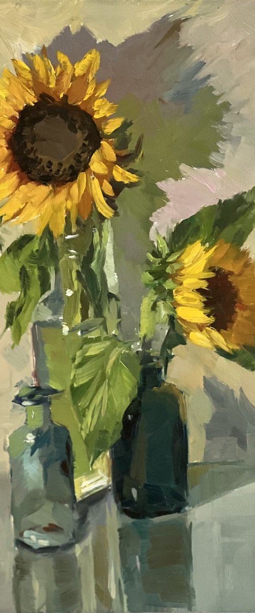 Sunflowers with little blue glasses by Nithya Swaminathan