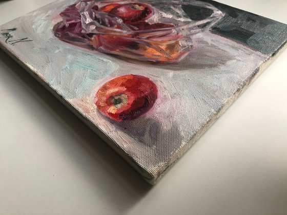 Red apples in plastic bag