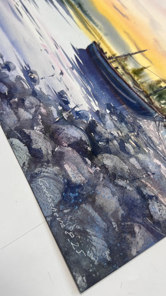 A lonely boat at sunset