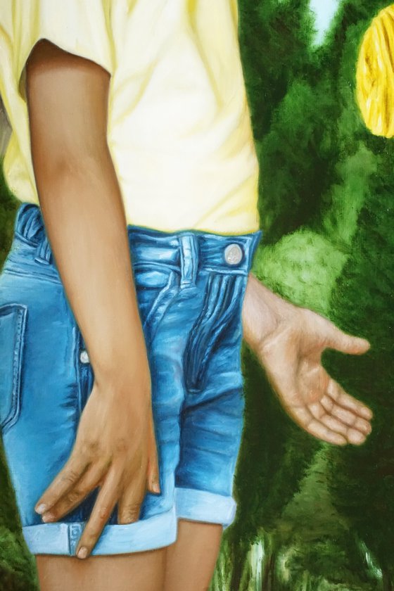 Girl showing a rose bush