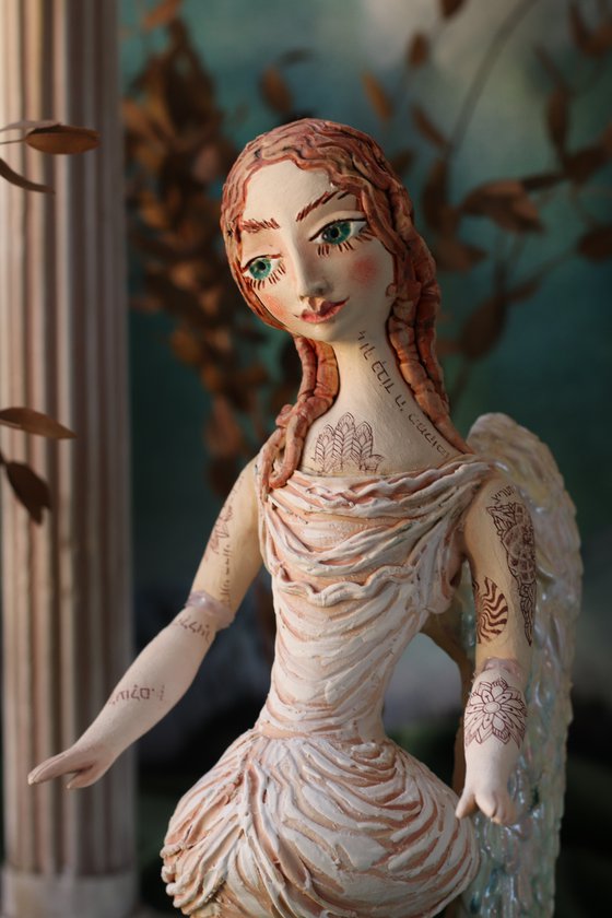 Angel with a tattoo. Ceramic OOAK sculpture.