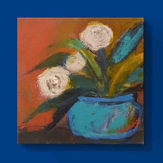 White flowers in a blue vase
