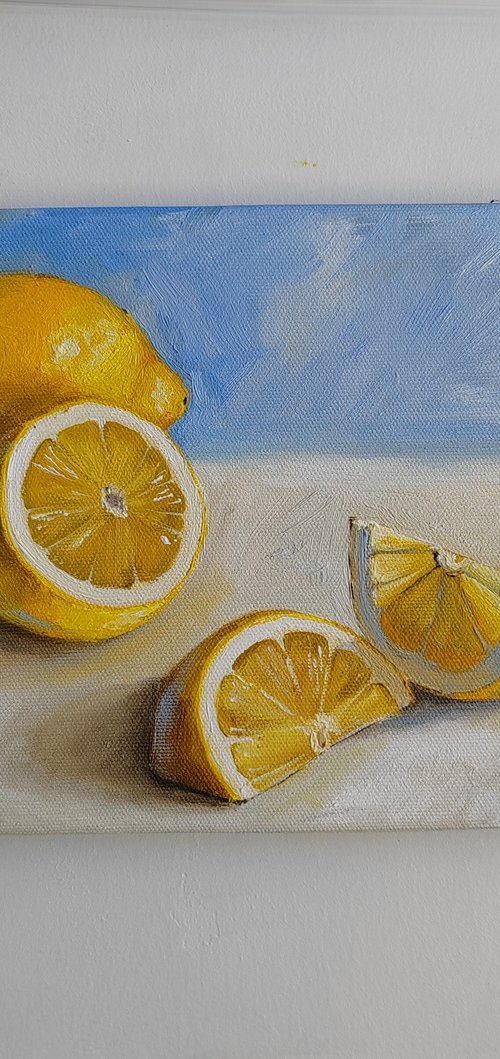 Lemon on royal blue background by Leyla Demir