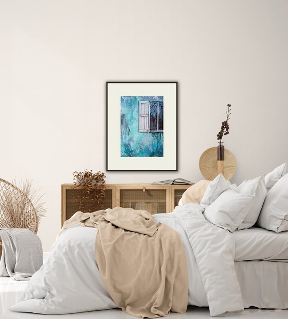 A window in a turquoise wall