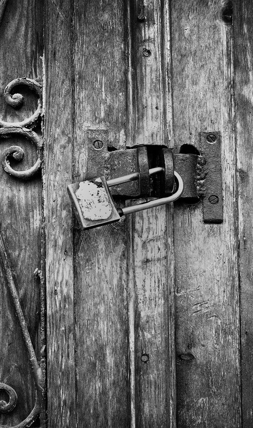 Old door with lock by Abba Richman