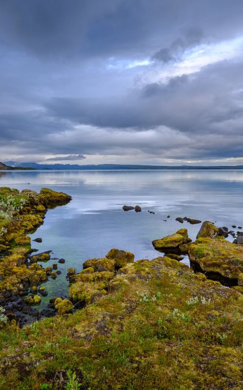 View across tranquil lake, Þingvallavatn, Iceland by Baxter Bradford