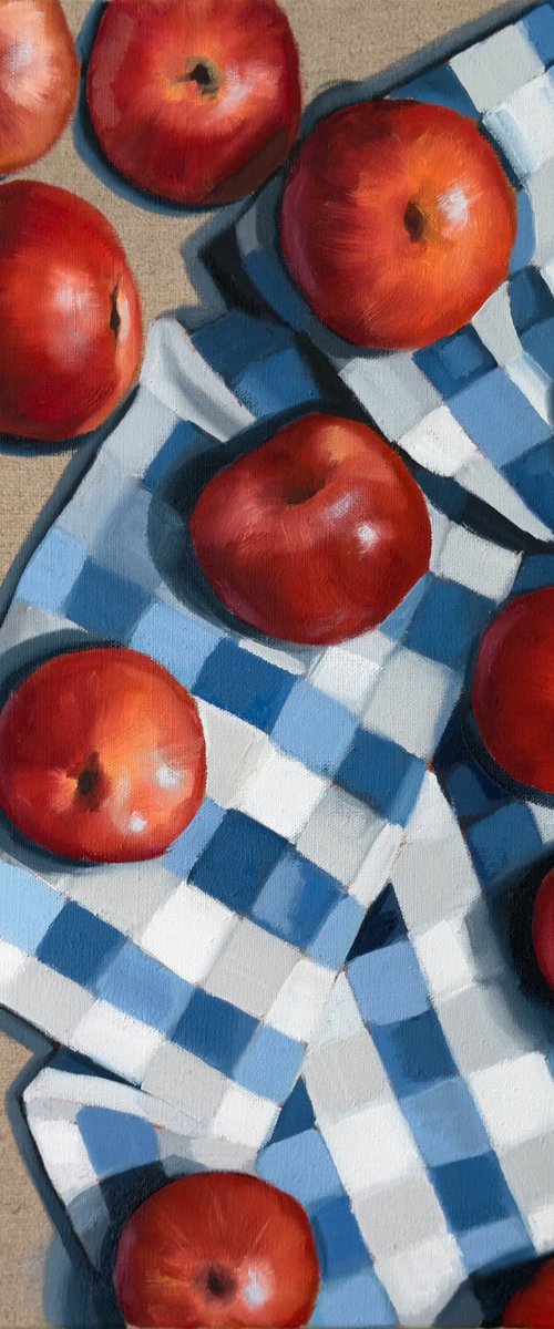 Red apples on a kitchen towel by Daria Gerasimova