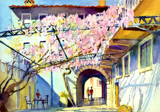 Wisteria Courtyard, Soave. Verona, Italy. Pink Flowers and old building
