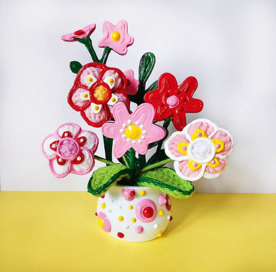 Knitted flowers in vase