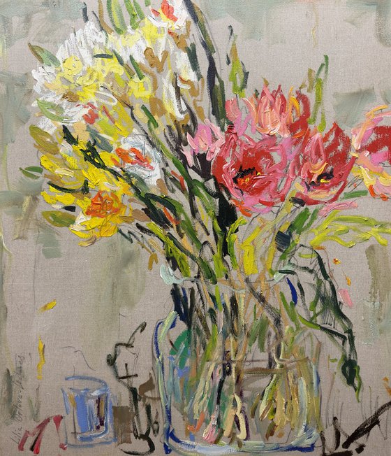 Tulips and daffodils in a glass vase