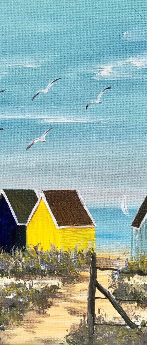 Beach huts on the beach by Marja Brown
