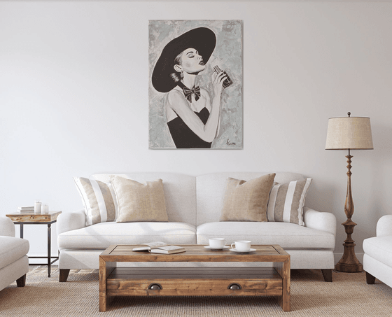 Woman with a bottle of perfume