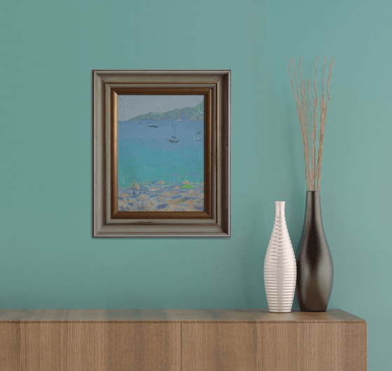 Yachts and umbrellas on the beach