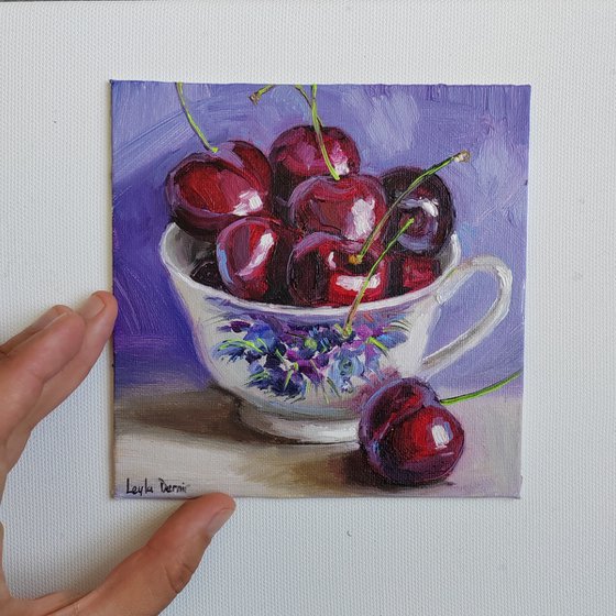 Cherries in porcelain cup