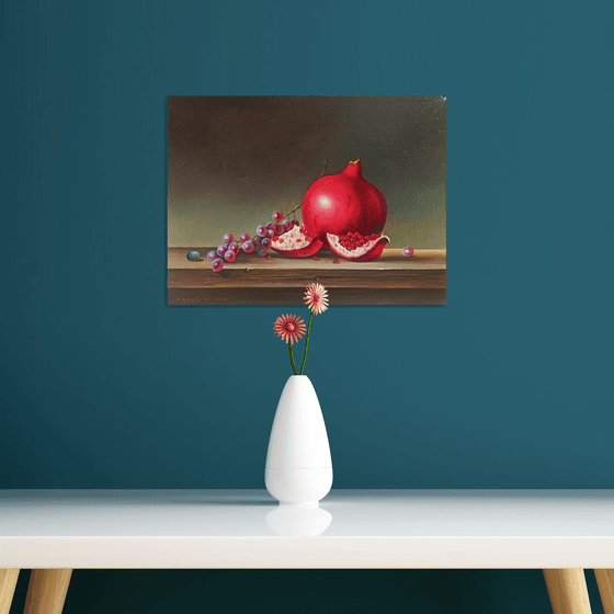 Still life with pomegranate and grape