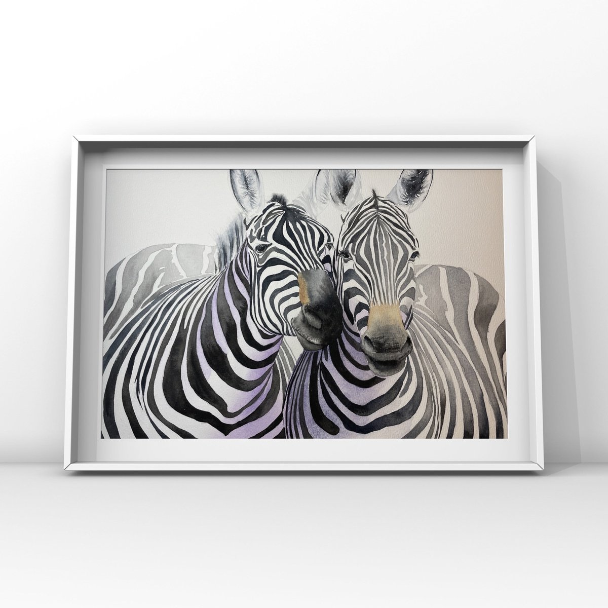 Zebras cuddle by Lucia Kasardova