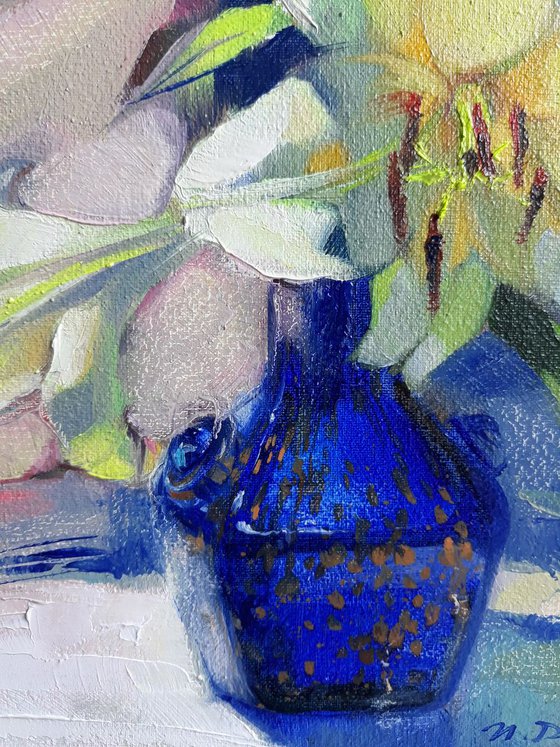 Lily in a blue vase
