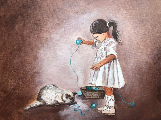 Girl playing with cat