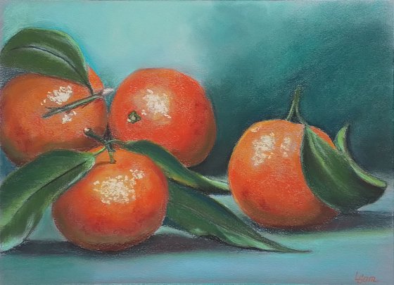 Golden-red tangerines on a turquoise background