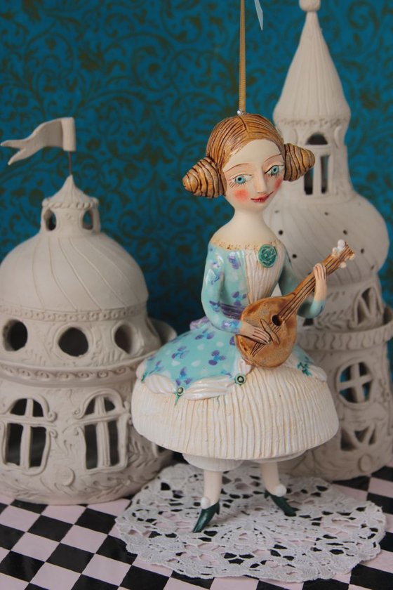 Girl with a mandoli. Ceramic hanging sculpture