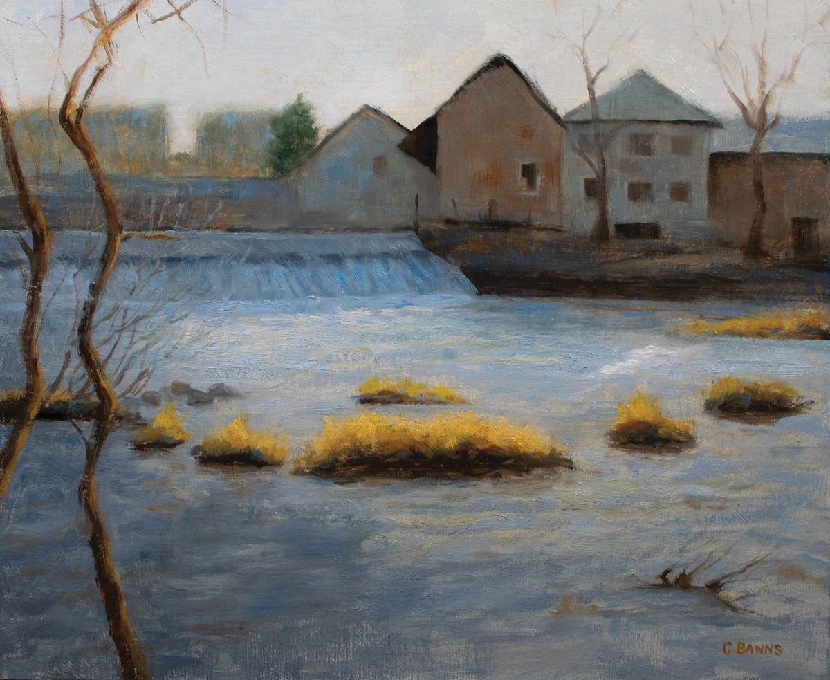 Weir and old industry on the river Vienne on a winter