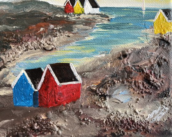 Beach Huts in a Cove