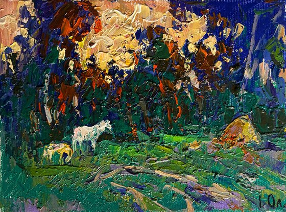 Yellow sunset behind tree