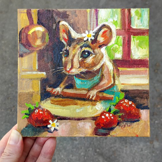 The mouse is baking a strawberry pie